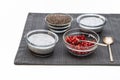 Chia seeds in a glass bowl, Chia seed pudding, and pomegranate seeds close up on white Royalty Free Stock Photo