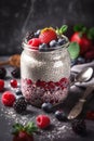 Chia seeds pudding in a tall glass with mixed berries.