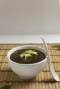 Chia seeds with soy sauce and nori seaweed with green frisse on a bamboo napkin. Vegan snack concept. Royalty Free Stock Photo