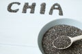 Chia seeds in a wooden spoon in a bowl on the table close-up. Royalty Free Stock Photo