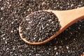 Chia seeds in wooden spoon, macro, healthy food supplements Royalty Free Stock Photo