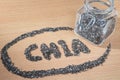 Chia word made from chia seeds on wooden plate Royalty Free Stock Photo