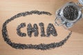 Chia word made from chia seeds on wooden plate Royalty Free Stock Photo