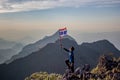 Asian trekking man holding Thailand flag Royalty Free Stock Photo