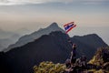 Asian trekking woman holding Thailand flag Royalty Free Stock Photo