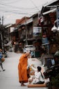 CHIANG KHAN , LOEI, Thailand - 21 OCT, 2020 : Thai monks go with a bowl to receive food or Sticky rice from tourist in