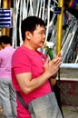 Chiang Mai, TH: Man Praying at Wat Ched Yod