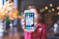 CHIANG MAI, THAILAND - Apr.08,2019: Woman holding Apple iPhone 6S Rose Gold with icons of social media on screen.