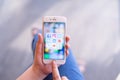 CHIANG MAI, THAILAND - Apr.08,2019: Woman holding Apple iPhone 6S Rose Gold with icons of social media on screen. Royalty Free Stock Photo