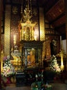 Vertical view. Temple with the image of a revered monk next to the Wat Chedi Luang stupa in Chiang Mai