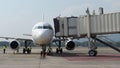Chiang Mai, Thailand 25 Dec 2021 Passenger jet aerobridge bridge to plane at airport boarding timelapse