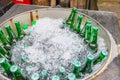 Chiang Mai,THAILAND - December 28 2022: Heineken beer bottles cool chilled in ice buckets for sale at roadside walking street food