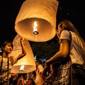 Chiang Mai, Thailand - December 31, 2017: People in crowds are launching sky lanterns, flying lanterns, floating lanterns, hot-air Royalty Free Stock Photo