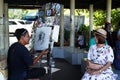 Chiang Mai, Thailand - December 3, 2017: Unknown street artist is drawing portrait of woman.