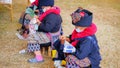 Closeup group of Thailand hill tribes are sewing patterns as souvenirs to sell to