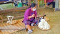 Closeup Thailand hill tribes woman are weaving silk into yarn to be used in weaving