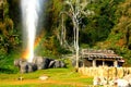 Beautiful Fang hot springs make rainbow with green plant and blue sky background at Doi Pha Hom Pok National Park