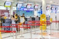 Travellers checking in at airport check in counters at Chiang Mai International Airport, Thailand Royalty Free Stock Photo