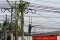 CHIANG-MAI, THAILAND. 15 JUNE 2023 : Technician cutting cable and Electricians are dismantling the wiring from the building.