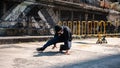 A cool, professional Asian male hiphop breakdancer is dancing performing on the street Royalty Free Stock Photo