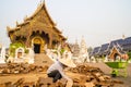 Chiang Mai/Thailand - March 16, 2019: Worker is paving the walkway with cobblestones in a Buddhist temple.