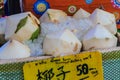 Chiang Mai, Thailand - May 3, 2017: Peeled young coconuts on ice Royalty Free Stock Photo