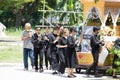 CHIANG MAI, THAILAND - MAY 19: Unidentified sad people in black cloths walking around the wooden palace of the dead body Thai