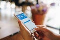 CHIANG MAI, THAILAND - May.01,2019: Woman holding Apple iPhone 6S Rose Gold with facebook app on the screen.