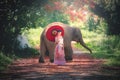 Chiang Mai, Thailand-May 13,2018: Young Asian Woman wearing Lanna traditional style costume with elephant in Chiang Mai, Thailand Royalty Free Stock Photo