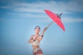 Chiang Mai, Thailand-May 13,2018: Young Asian Woman wearing Lanna traditional style costume with red umbrella in Chiang Mai, Royalty Free Stock Photo