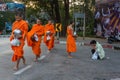 Monks collect donations in Chiang Mai, Thailand