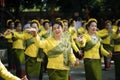 CHIANG MAI, THAILAND - November 11, 2018 : Asian women dressed in yellow traditional cloth are dancing at the traditional merit