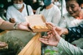 Chiang Mai - Thailand November 25, 2023 : Hungry citizens come to request free food from volunteers in Chiang Mai Province,