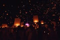 Chiang Mai - Thailand November 27, 2023 : Tourists happily celebrate releasing lanterns at the Loi Krathong Yi Peng Lantern