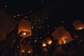 Chiang Mai - Thailand November 28, 2023 : Tourists happily celebrate releasing lanterns at the Loi Krathong Yi Peng Lantern