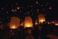 Chiang Mai - Thailand November 27, 2023 : Tourists happily celebrate releasing lanterns at the Loi Krathong Yi Peng Lantern