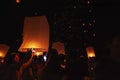 Chiang Mai - Thailand November 28, 2023 : Tourists happily celebrate releasing lanterns at the Loi Krathong Yi Peng Lantern