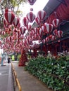 Chiang mai/ Thailand - 16.12.2017 Red white balloons and Christmas tree on the street in Asia