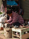 Chiang Mai, Thailand - September 26, 2020: The Cobbler or shoemaker while working