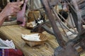 woman spinning cotton into thread with traditional wheel Royalty Free Stock Photo