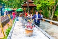 CHIANG MAI, THAILAND - 4.11.2019: Tourist light a candle in temple Wat Phra Singh, Chiang Mai city, Thailand. Candles are placed Royalty Free Stock Photo