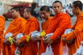 Young monks collect donations in Chiang Mai, Thailand