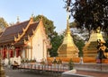 Chiang Rai Province, Thailand - February 18, 2019: Wat Phrathat Doi Tung with two golden stupas at the top of Doi Tung Mountain.