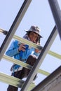 CHIANG RAI, THAILAND - AUGUST 20 : close-up unidentified male roofer working on the roof on August 20, 2018 in