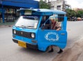 an old woman is trying to get on an public transport