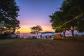 Chiang Rai, Thailand-December 14, 2021 : A group of camping tourists are enjoying the evening against the beautiful evening sky