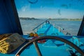 CHIANG RAI, THAILAND - FEBRUARY 01, 2018: Close up of the captain hands in the cabin sailing a boat in the waters of