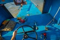 CHIANG RAI, THAILAND - FEBRUARY 01, 2018: Close up of the captain hands in the cabin sailing a boat in the waters of