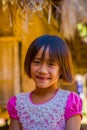 CHIANG RAI, THAILAND - FEBRUARY 01, 2018: Close up of unidentified smiling little girl belongs to a Karen Long Neck hill Royalty Free Stock Photo