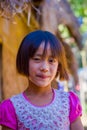 CHIANG RAI, THAILAND - FEBRUARY 01, 2018: Close up of unidentified smiling little girl belongs to a Karen Long Neck hill Royalty Free Stock Photo